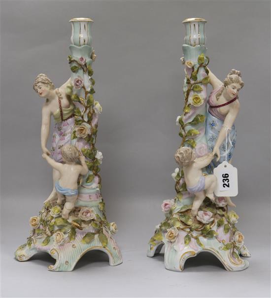 A pair of Sitzendorf candlesticks (missing candelabra arms)